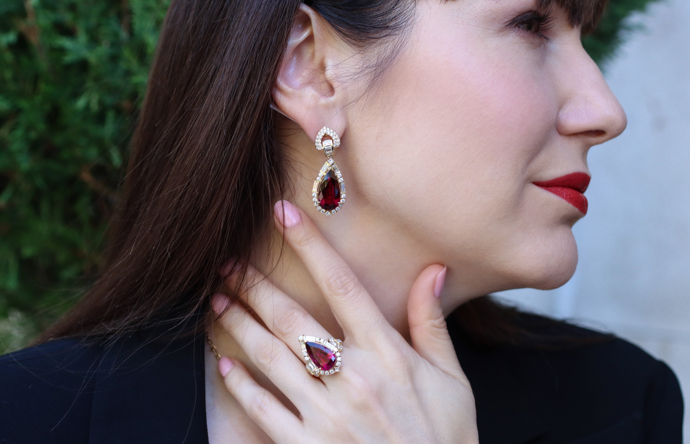 Katerina Perez wears the Celestial Dragon earrings and matching ring by Sunita Nahata, set with pear-shaped rubellites and baguette-, princess- and round brilliant-cut diamonds in 18k yellow gold 