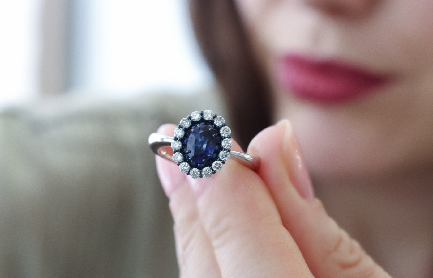  Daverio1933 Essentials collection ring with an oval-shaped sapphire centre stone, surrounded by further sapphires and round brilliant-cut diamonds in 18k white gold 