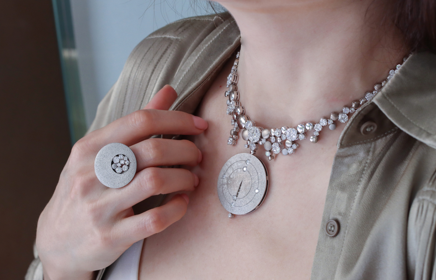 Katerina Perez wears the Daverio1933 Sidereum collection necklace and matching ring crafted in titanium and decorated with round and fancy-cut diamonds  