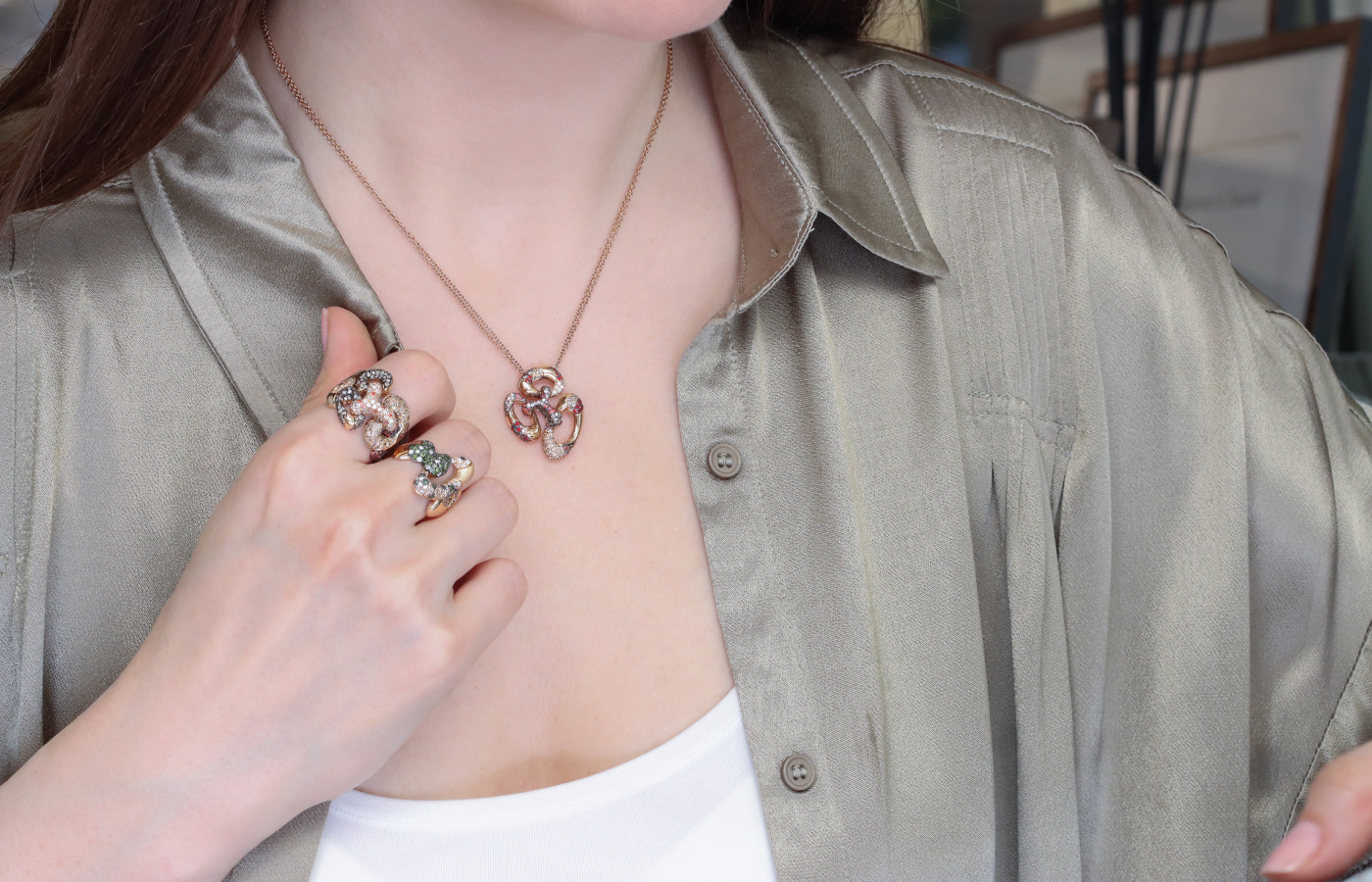  Katerina Perez wears rings and a pendant from the Daverio1933 ForeverHug Me collection