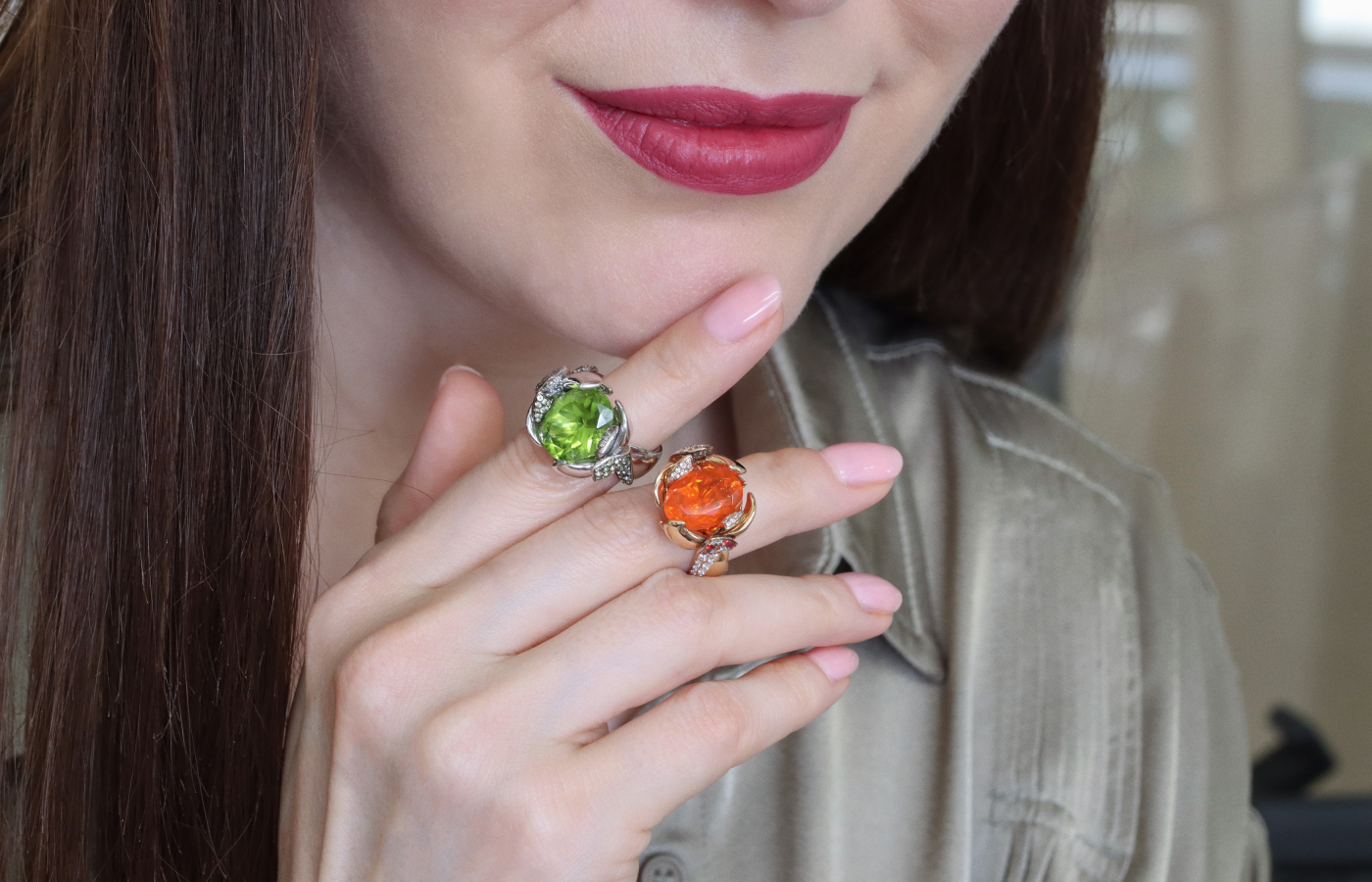  Katerina Perez wears two Calafate rings from the Daverio1933 Masterpieces collection set with a 7.02 carat peridot and a 3 carat fire opal