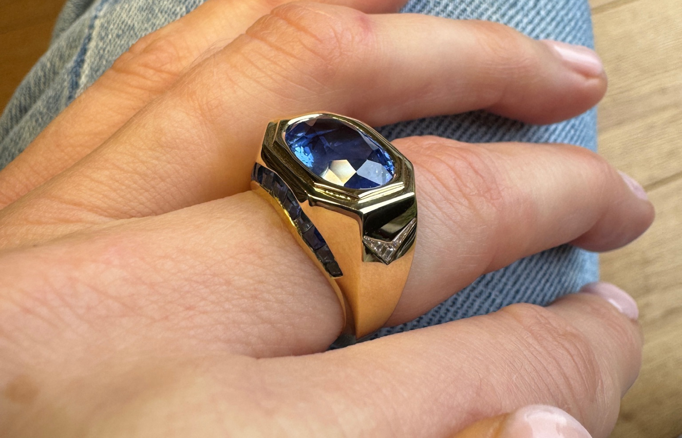 Hattie Rickards’ bespoke ring for her client Jane, crafted with an heirloom blue sapphire and custom-cut carré diamonds, set in yellow gold