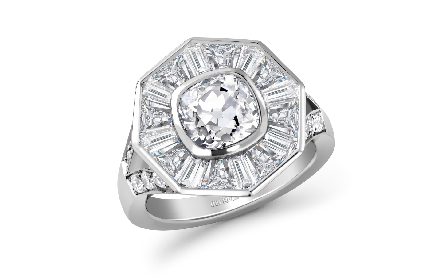 Hattie Rickards’ bespoke Halo ring for Ellie, crafted with a brilliant cut heirloom diamond along with custom-cut tapered baguettes and carré-cut diamonds, set in white platinum