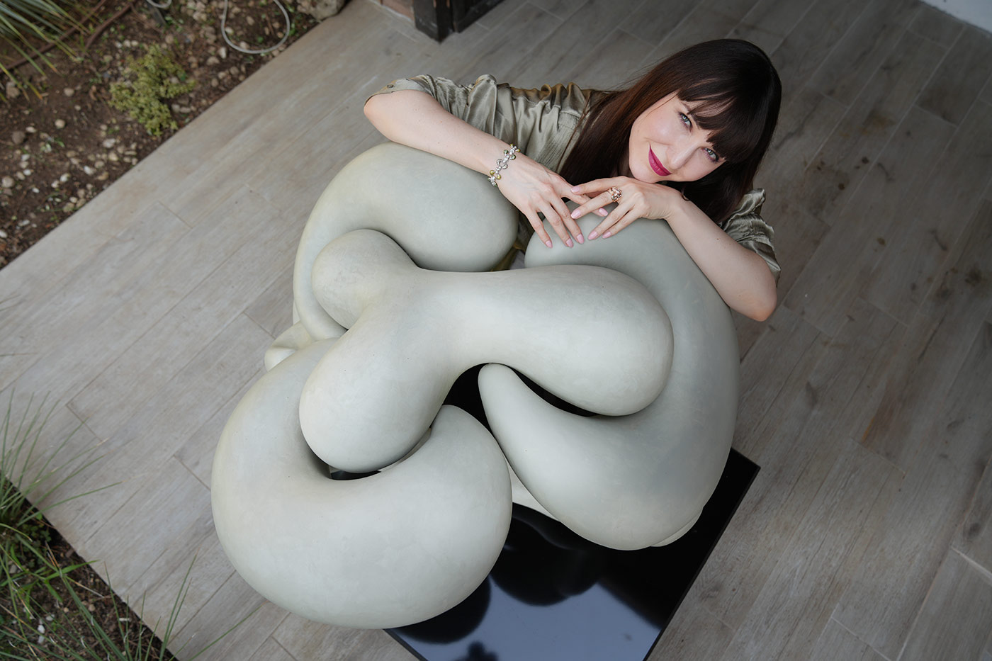 Katerina Perez with a piece of sculpture presented at the Daverio1933 boutique in Bergamo, Italy 