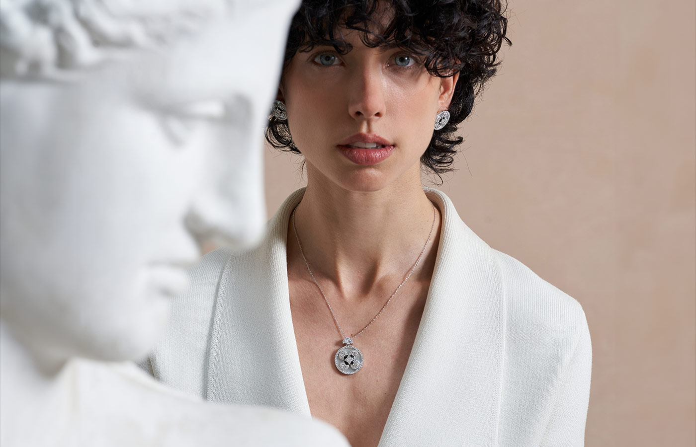  A model wears the Miseno Baia button stud earrings with mother of pearl, onyx and 1.96 carats of white diamonds, alongside a matching pendant with onyx and 2.29 carats of white diamonds