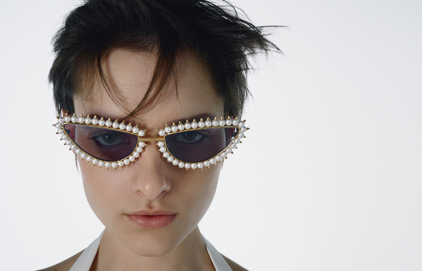  Model wears Tasaki x Eyevan sunglasses with Akoya pearls, from the Danger collection