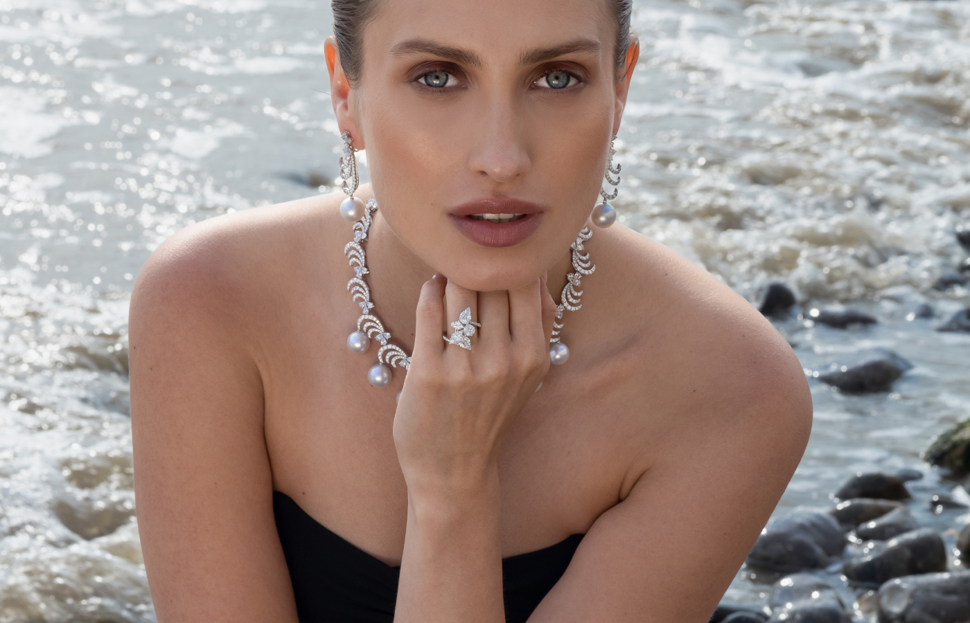  Model wears a Yoko London necklace with South Sea Pearl diamonds in 18k white Gold, a matching pair of Yoko London earrings with South Sea pearl and diamonds in 18k gold, both from the Whisper collection,  and a Yoko London ring with  diamonds in 18k white gold, from the Starlight collection