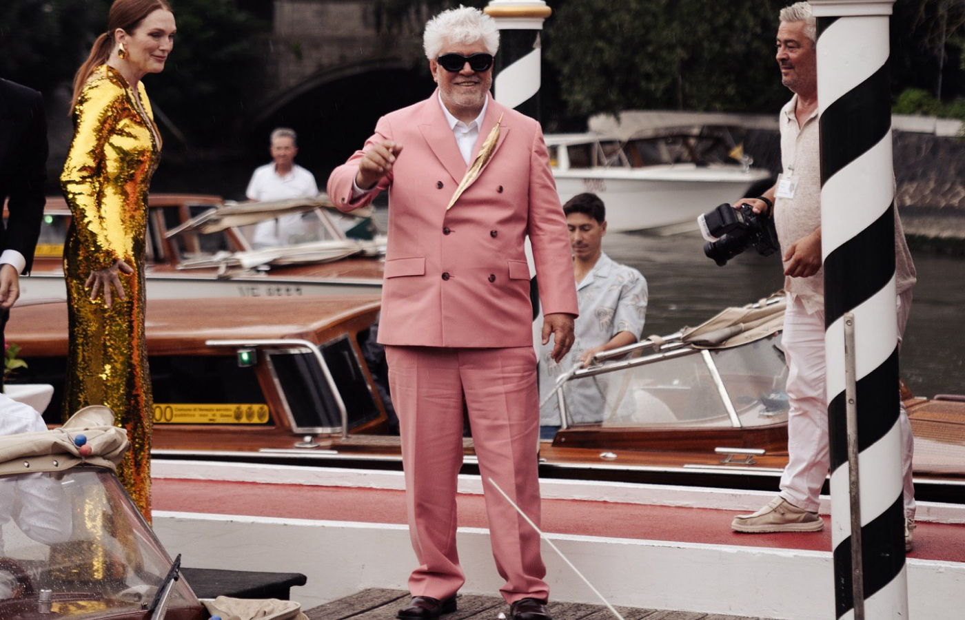  Pedro Almodóvar at the Venice Film Festival 2024 wearing a golden feather brooch by Jonathan Anderson, Creative Director of Loewe. Image credit: Instagram, @gusevagallery 