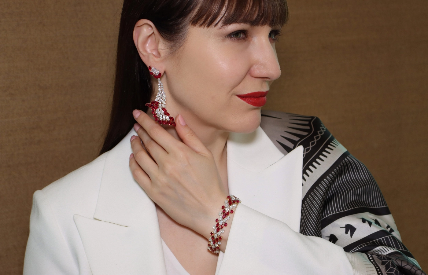  Katerina Perez wears a pair of Smart Arts earrings inspired by the shape of a flamenco dancer, set with 10.92 carats of marquise and round diamonds alongside marquise-shaped Burmese rubies, totalling 17.90 carats 
