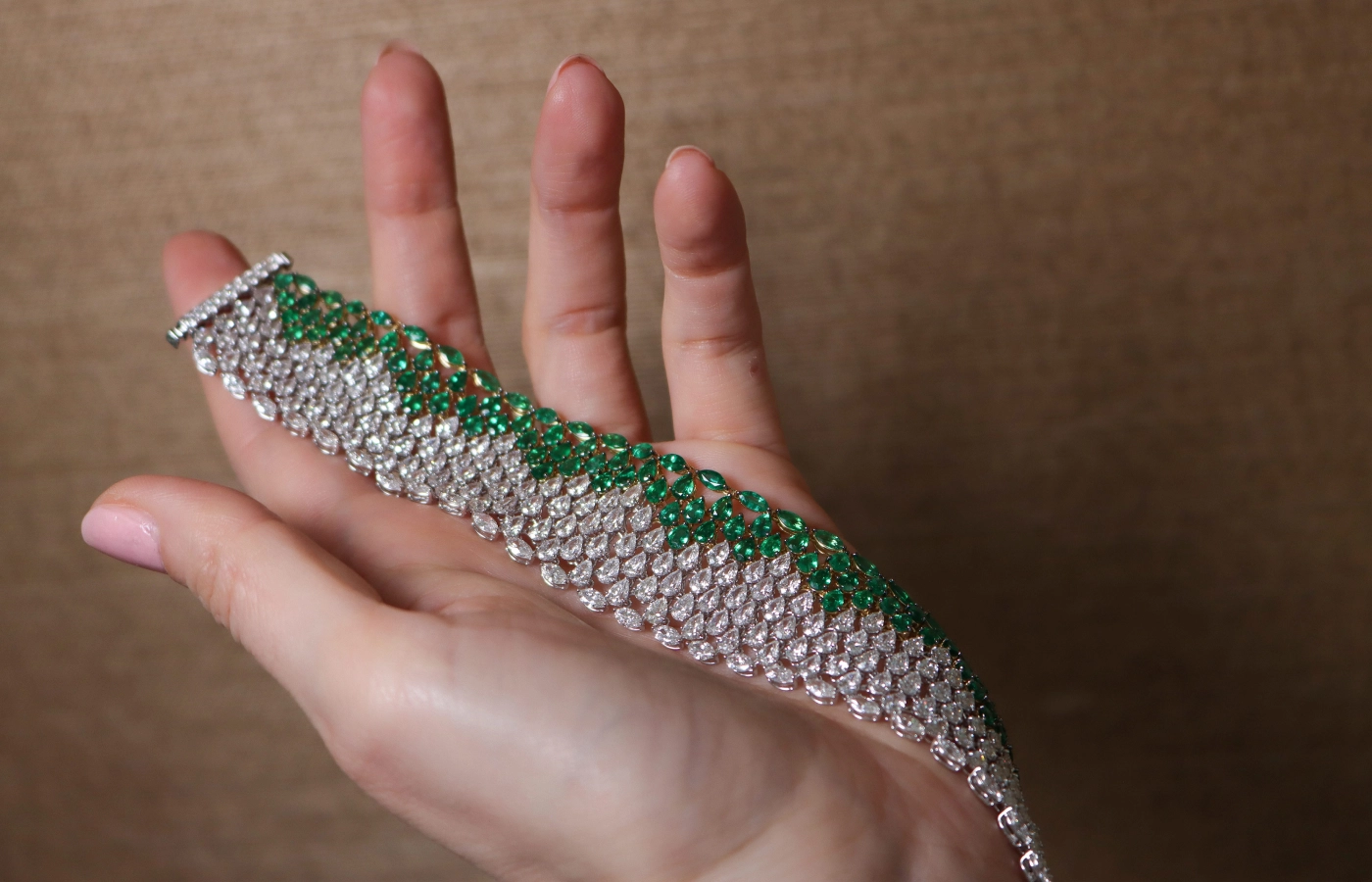  A flexible and fluid high jewellery bracelet by Smart Arts, set with 25.41 carats of diamonds and 14.49 carats of Zambian emeralds in 18k white and yellow gold 