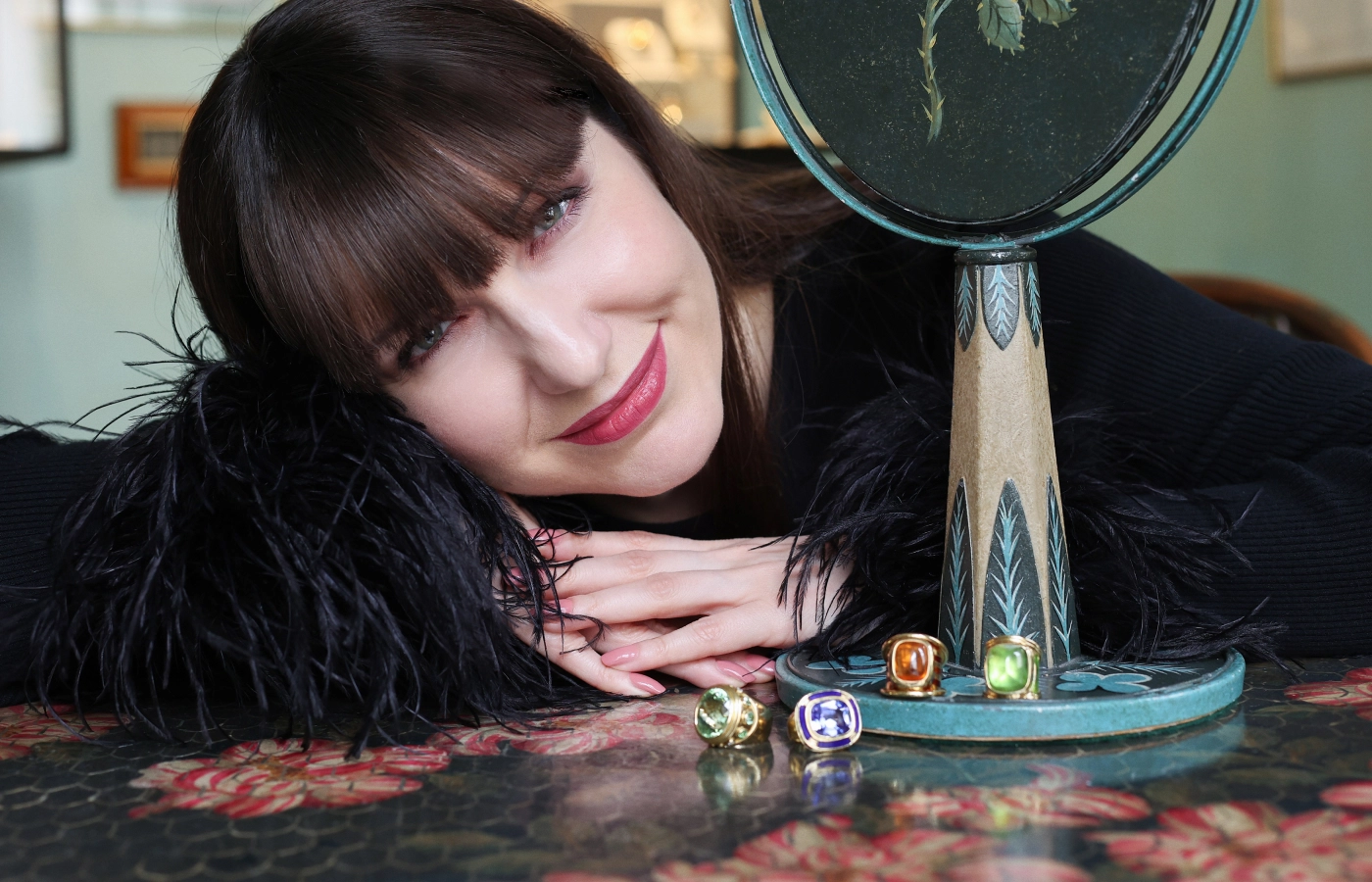 Katerina Perez presents rings by Elizabeth Gage, including (from left to right) a Charlemagne ring with a 17.70 carat mint green tourmaline, a Charlemagne ring with an 11.67 carat tanzanite, the Aramis ring with a 15.80 carat sugarloaf mandarin garnet, and a Templar ring with a 22.64 carat peridot, all in 18k gold 