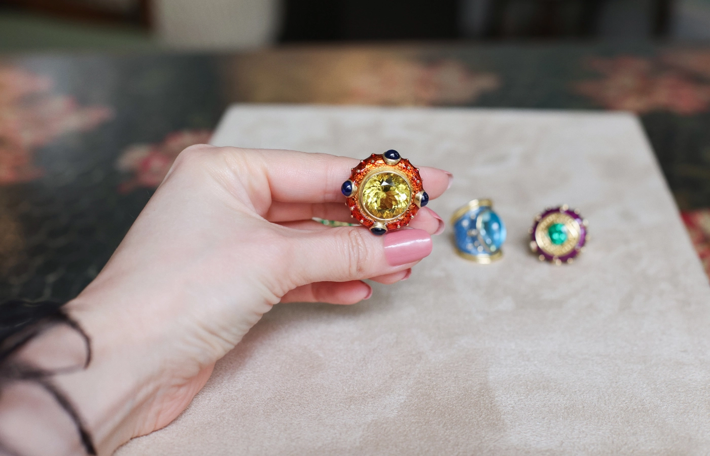  A closer look at the Elizabeth Gage Ottoman ring with a 17.17 carat Nigerian yellow beryl, 4.21 carats of sapphires, and orange enamel in 18k yellow gold