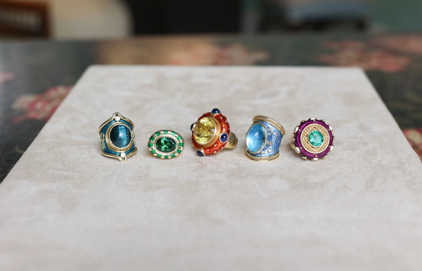  Elizabeth Gage rings including (from L-R) a 14.44 carat cat’s-eye tourmaline ring, a Charlemagne ring with a 5.72 carat green tourmaline, the Ottoman ring with a 17.17 carat yellow beryl, a Tapered Templar ring with a 12.83 carat aquamarine, and an Ottoman ring with a 4.6 carat Paraiba tourmaline