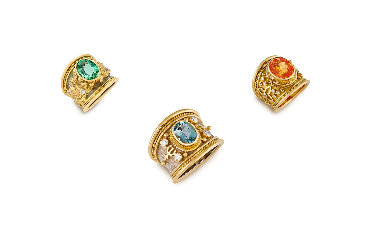  A trio of Templar rings by Elizabeth Gage including (from left to right) a 3.78 carat mint green tourmaline, a 1.60 carat aquamarine, and an 8.80 carat mandarin garnet, all crafted in 18k yellow gold 