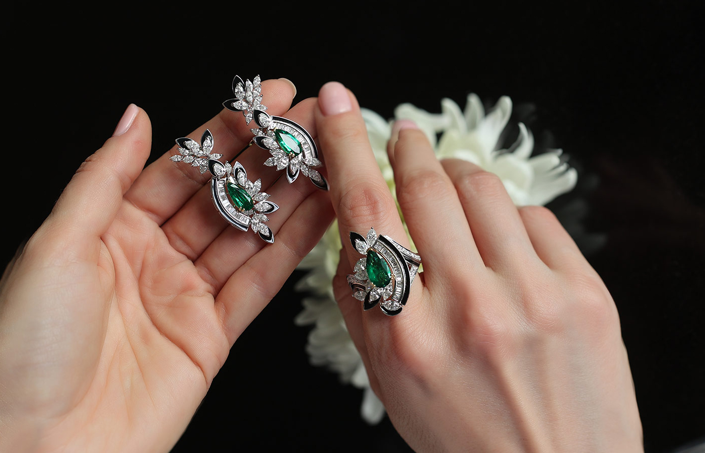  Hassanzadeh Jewellery Black Love earrings with 3.06 carats of emeralds and 5.76 carats of diamonds, alongside the Black Love ring with a 1.70 carat pear-shaped emerald and 2.18 carats of diamonds 