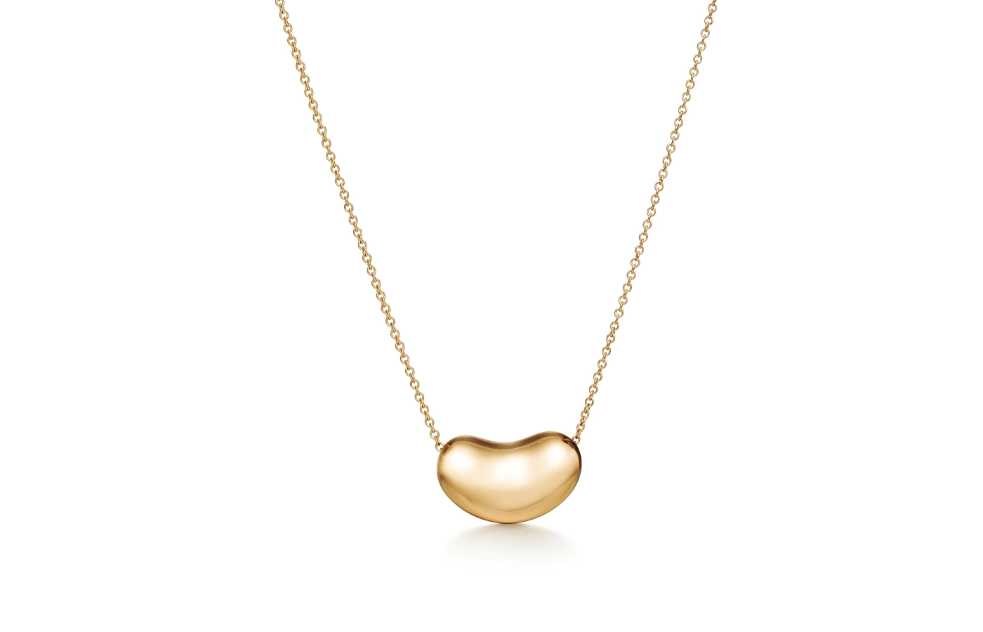  Tiffany & Co. Elsa Peretti Bean design pendant in 18k yellow gold, paired with a chain