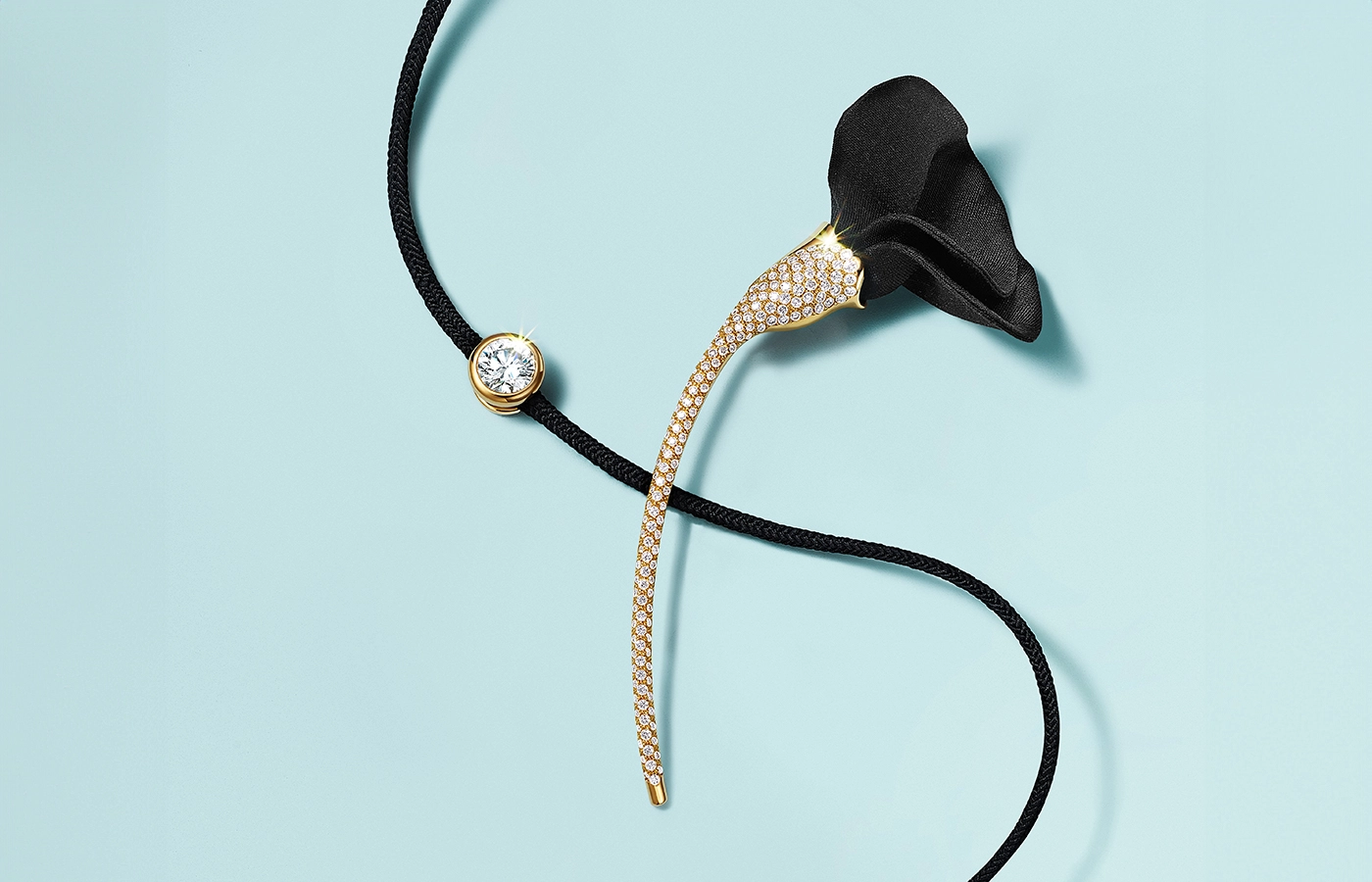 Tiffany & Co. Elsa Peretti Amapola brooch in 18k yellow gold with pavé diamonds and black silk, along with the Elsa Peretti Diamond on Silk necklace in 18k yellow gold