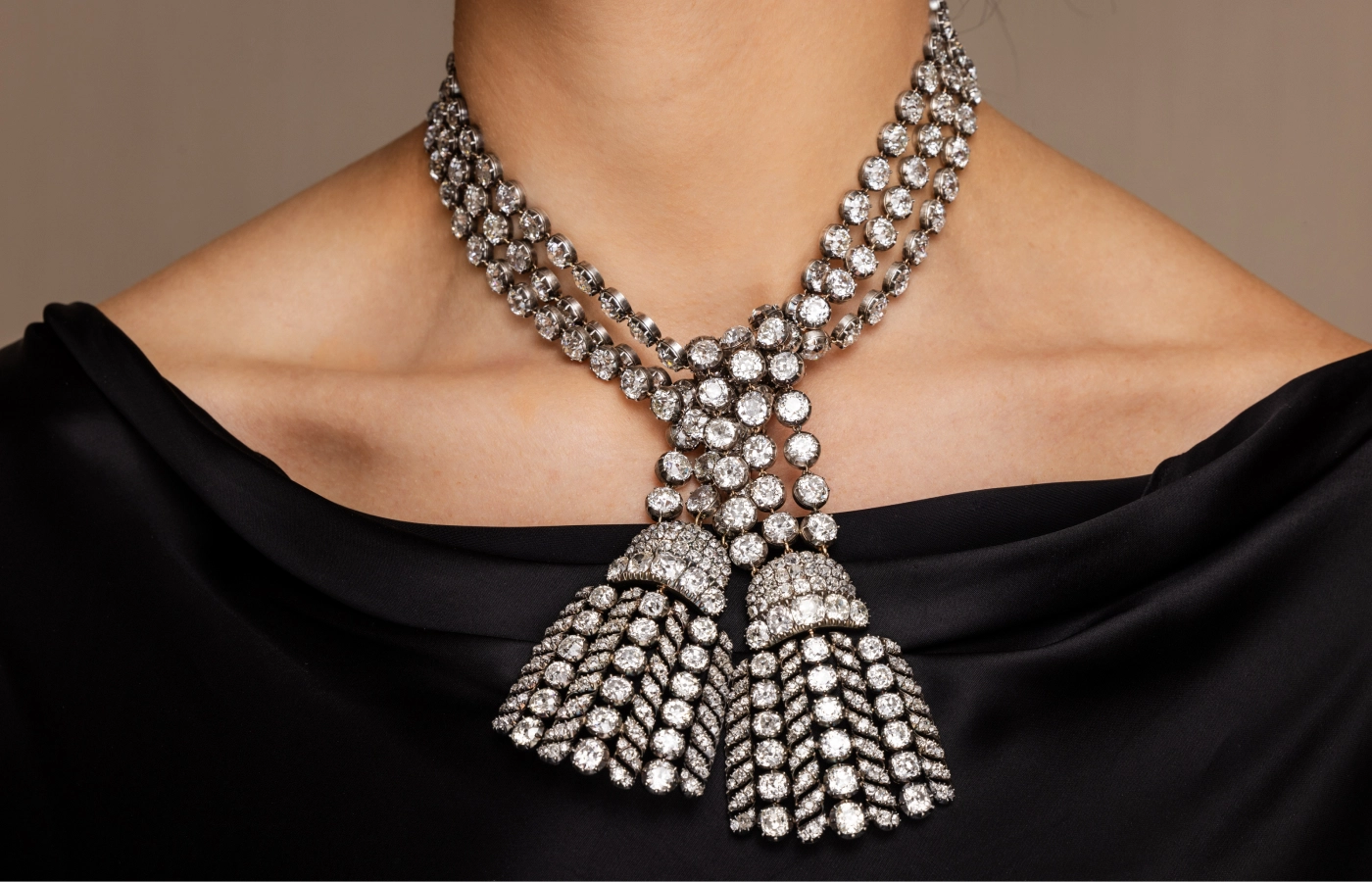  A model wears the 300-carat 18th-century diamond necklace as an elegant tie ahead of its sale by Sotheby’s Geneva 