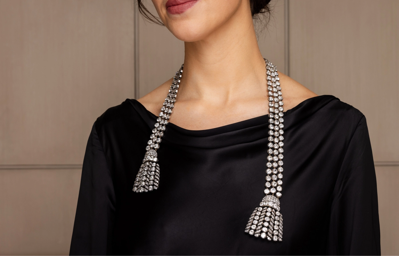 A model showcases the 300-carat 18th-century diamond necklace worn untied, set to be auctioned at Sotheby’s Geneva 