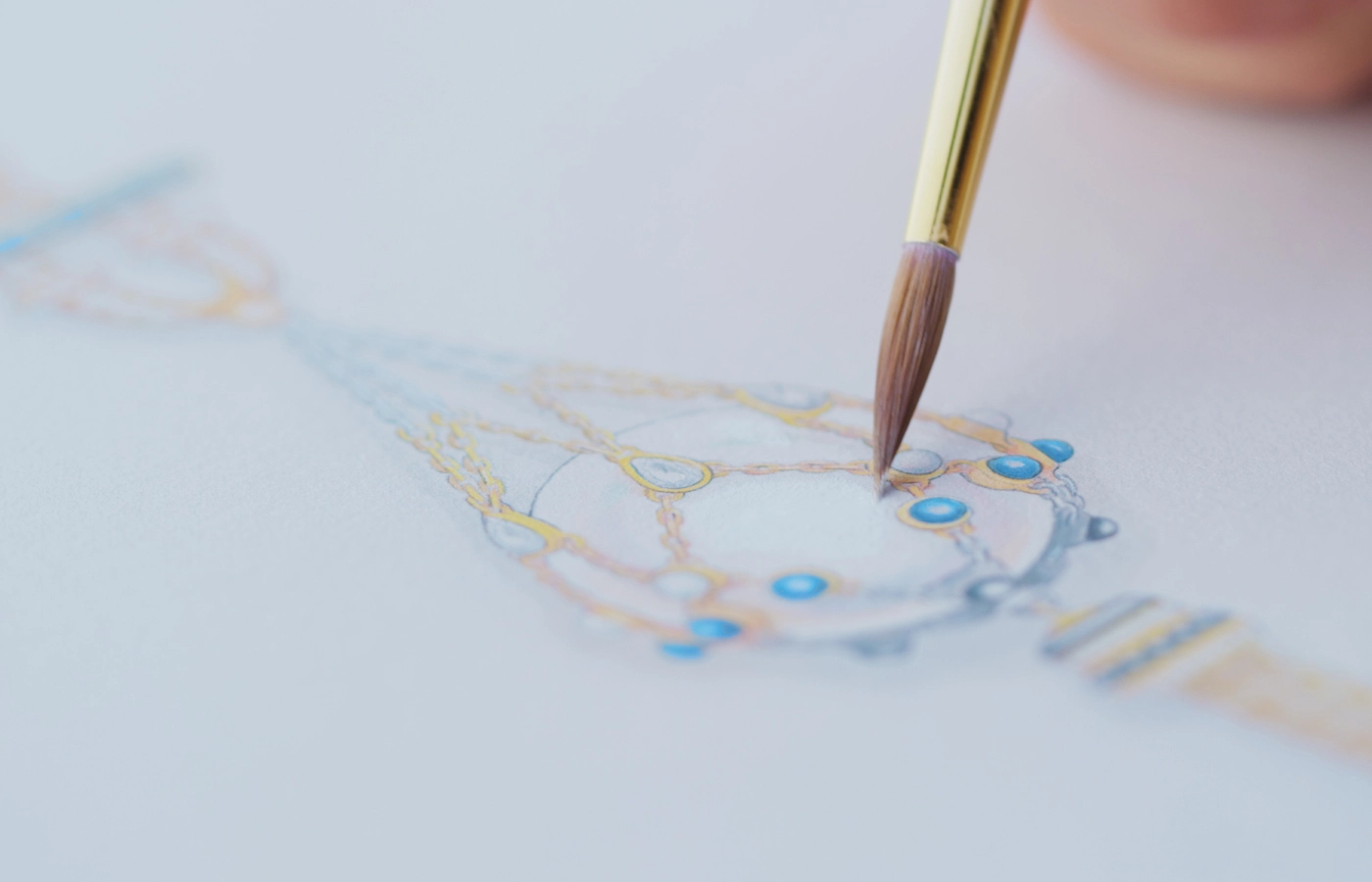  Designing the Paspaley Turquoise Anchored Lavalier pearl necklace with an 8mm Keshi baroque Australian South Sea pearl, white diamonds, turquoise, blue sapphire and rainbow moonstone, set in 18k yellow gold  