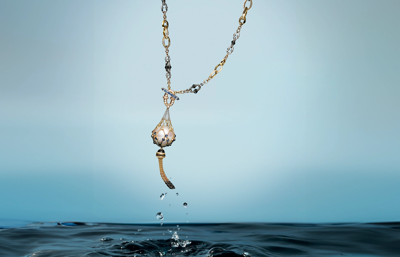 Paspaley Tassel Anchored Lavalier pearl necklace with white diamonds, black spinel, blue sapphires and rainbow moonstone in 18k yellow, rose and white gold 