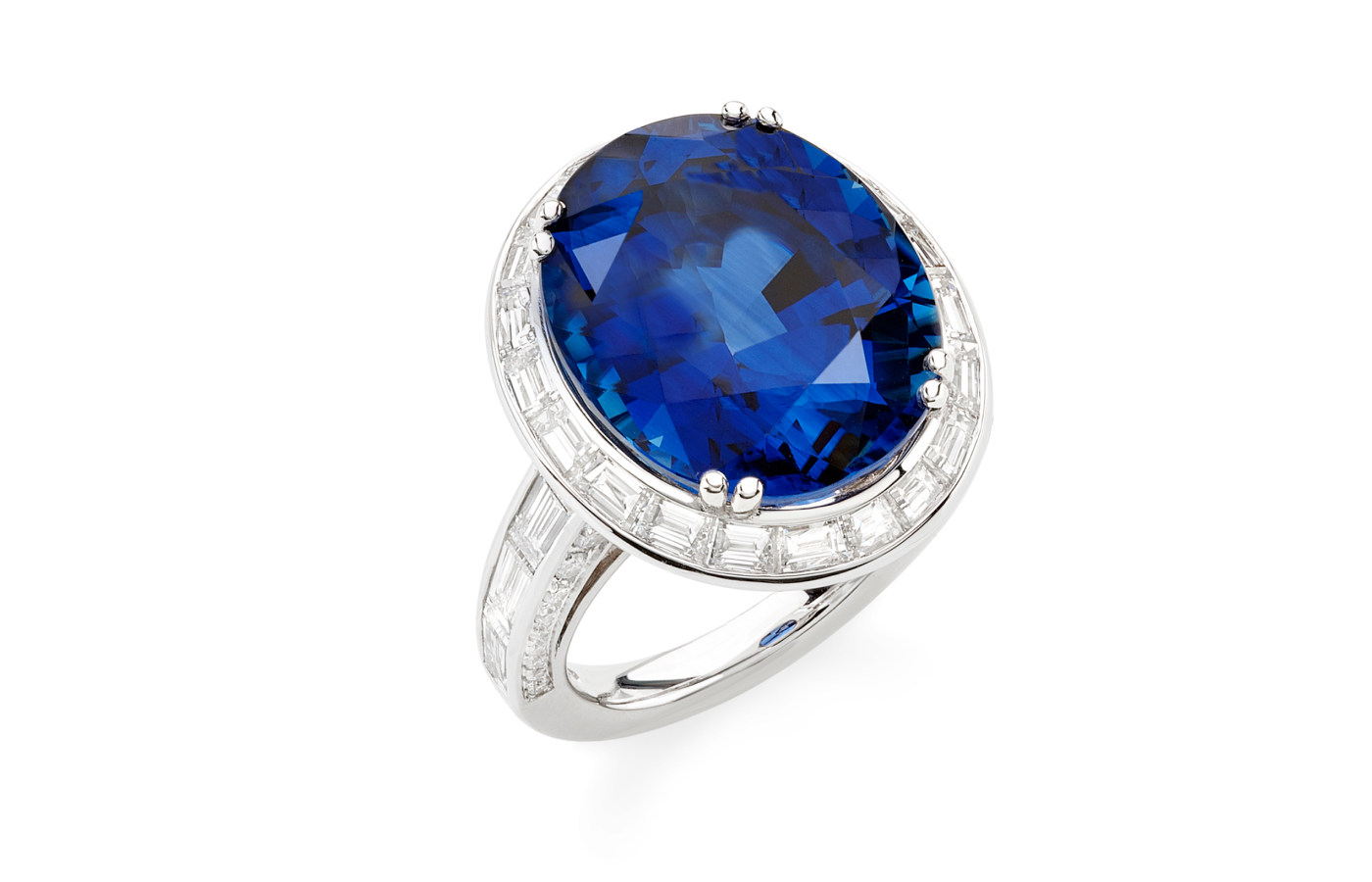  Picchiotti ring with an oval-shaped Sri Lankan ‘Royal Blue’ sapphire of 18.16 carats, 2.63 carats of baguette-cut diamonds, and 0.99 carats of round diamonds, set in 18k white gold 