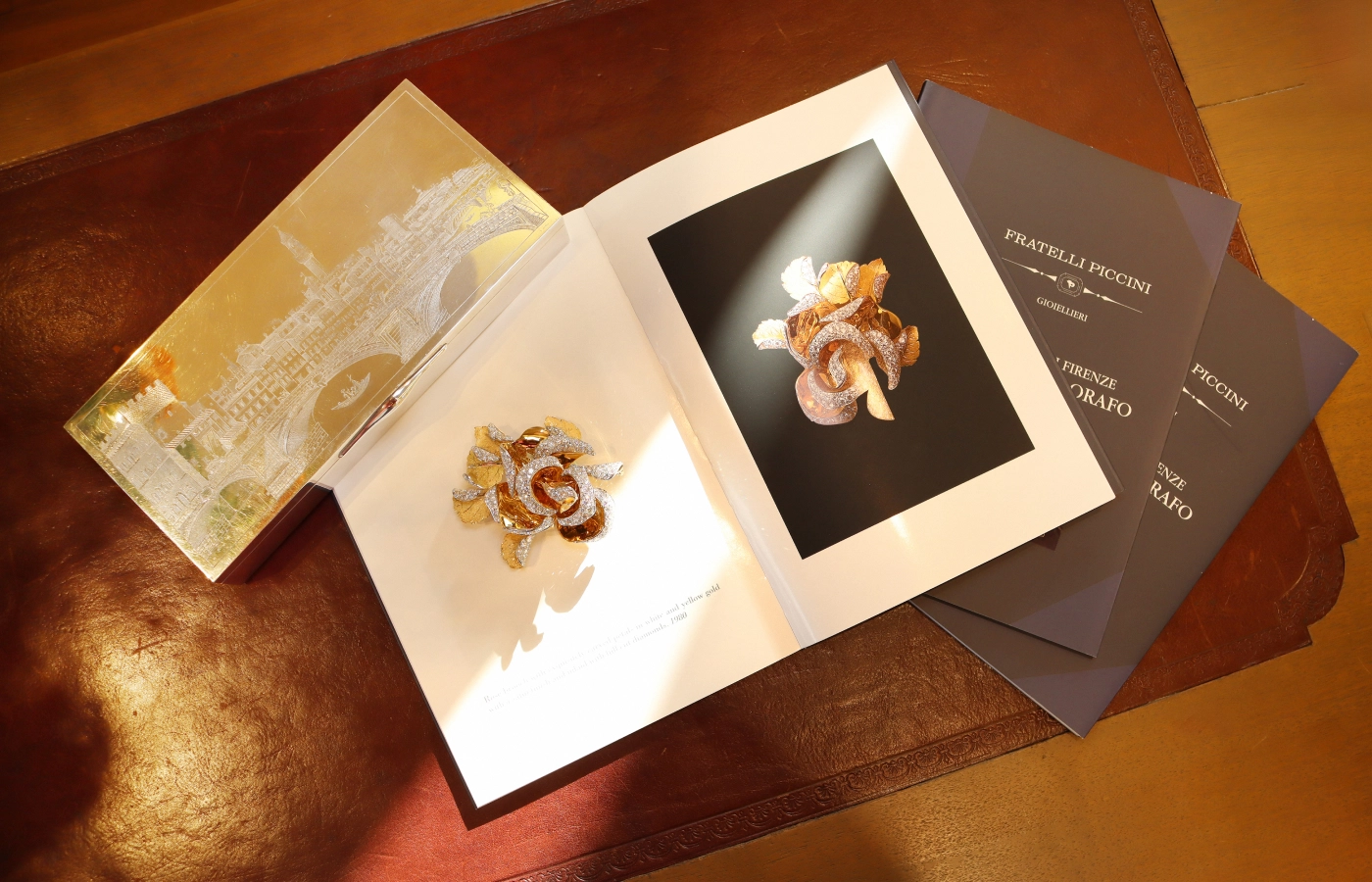  Fratelli Piccini Rosae brooch featuring 16.53 carats of diamonds showing the arrangement of the petals in 18k yellow gold, along with its image in the catalogue