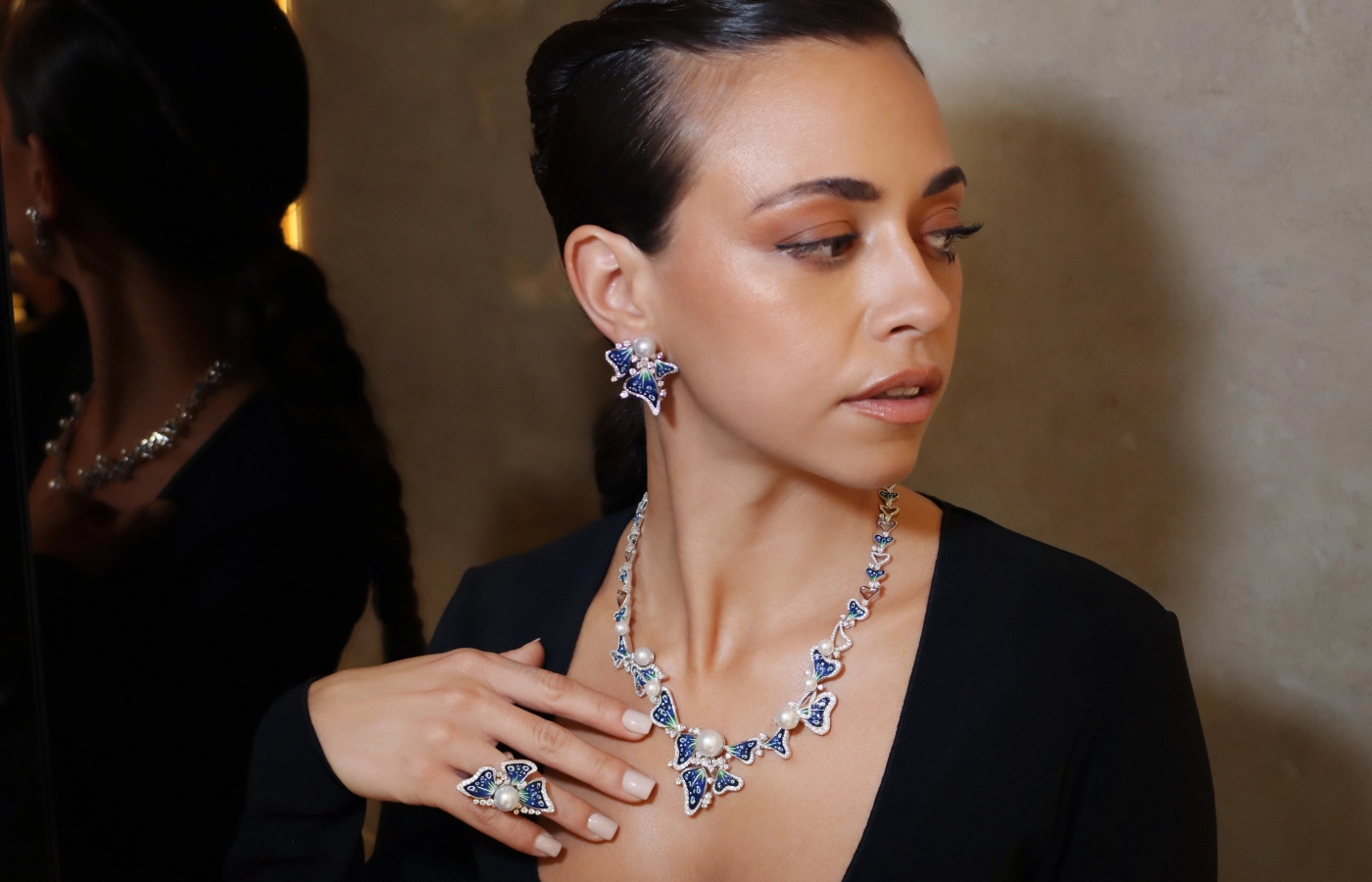  A model wears the Sicis Anemone Sea set, including a necklace, earrings and ring in white gold with diamonds and South Sea pearls at the opening of the Sicis boutique in Paris