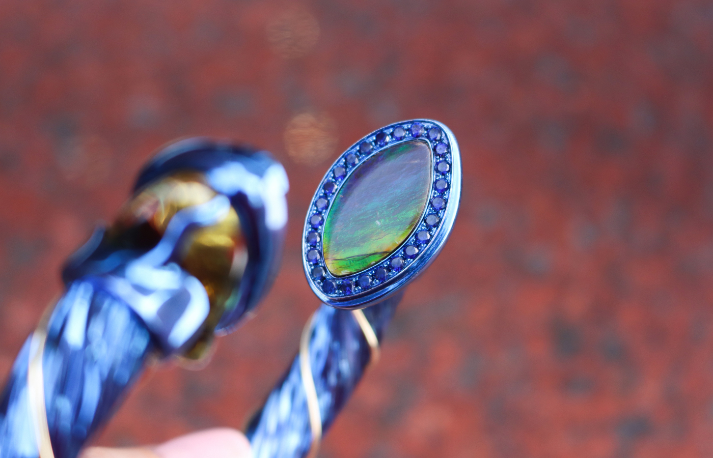  A closer look at one of the two marquise-shaped ammolites used in Susana Grau Batlle Evolution through Time ‘Time 2’ cuff (total 17.52 carats), set alongside citrines and blue sapphires in titanium and 18k yellow gold, part of the A Trilogy of Evolution High Jewellery collection