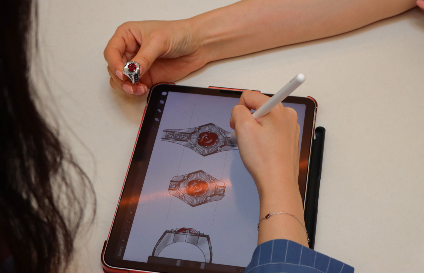 From hand-drawn sketches to the finished piece - a red spinel ring with grey spinel accents in titanium created by MADLY
