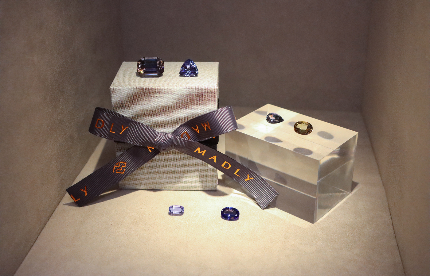 A section of the gem wall at the MADLY flagship 'Experience Centre' in Singapore featuring a curated selection of tanzanites, from greyish green unheated gems to heated bright blue specimens to show a striking variety for bespoke clients 