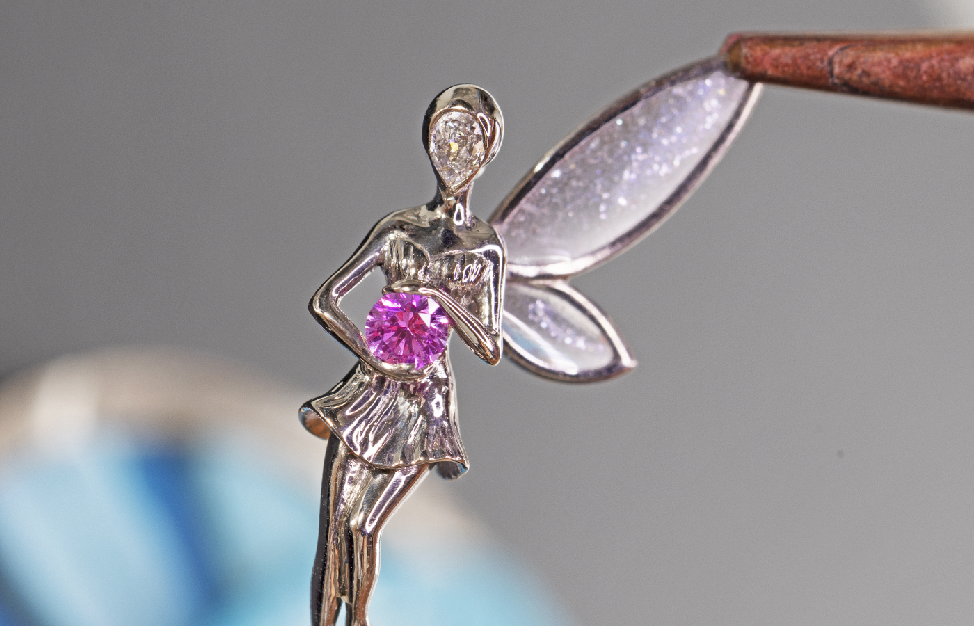  A fairy holding a pink sapphire sits on the dial of the Van Cleef & Arpels Lady Arpels Jour Enchanté