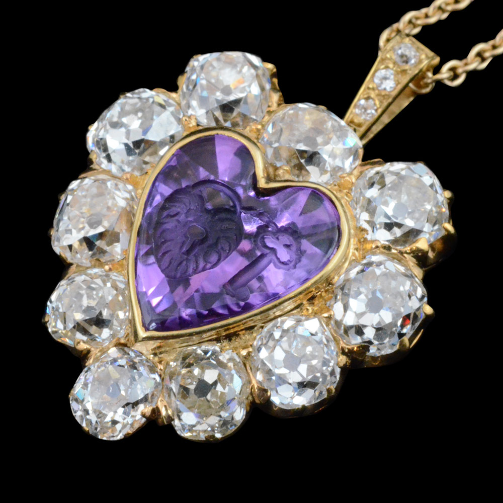 Enchanting amethyst intaglio of key and padlock, signifying ‘the key to your heart’ and an old mind diamond heart shaped pendant. By Tiffany, New York c1900.