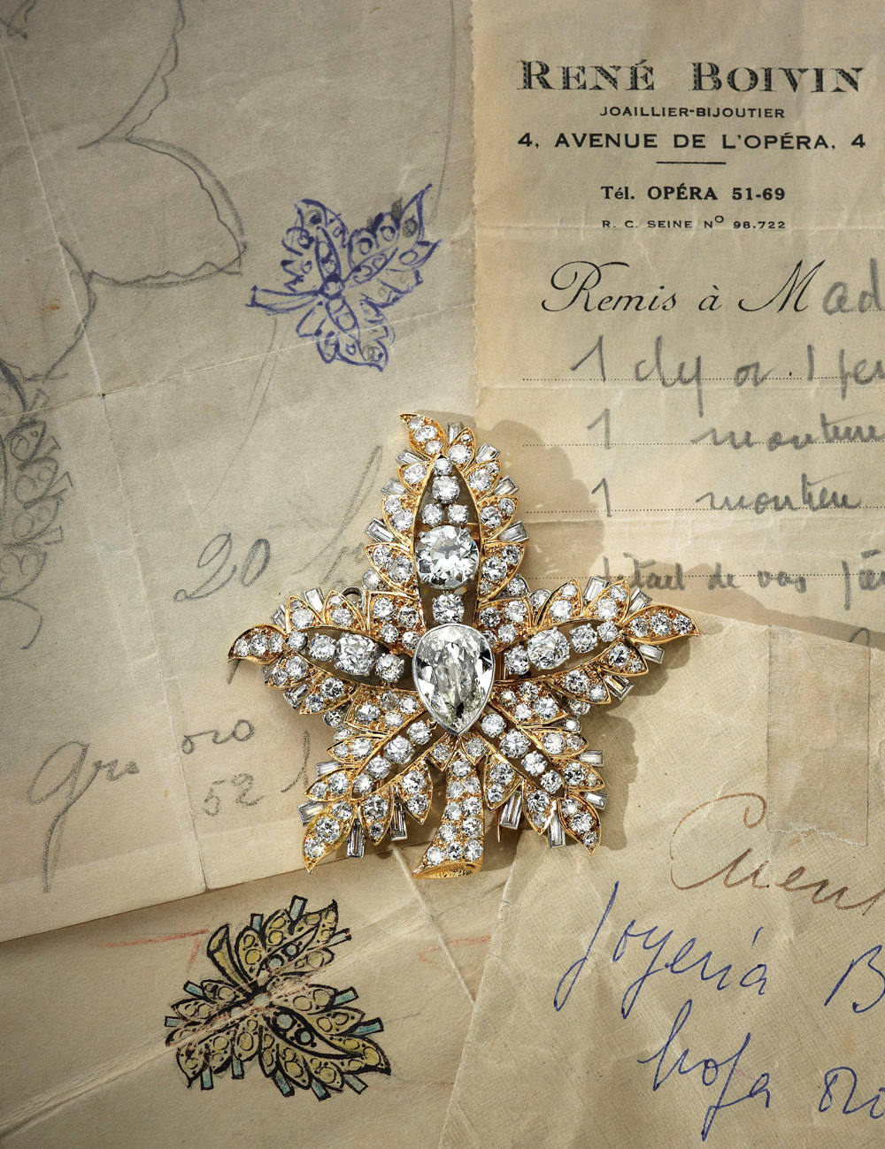  18ct yellow gold ‘Feuille de Platane’ clip brooch designed as s stylised leaf with five fronds set with a central pear-shape cape diamond and throughout with Old-European and brilliant-cut diamonds with baguette diamond details. By René Boivin, Paris 1948