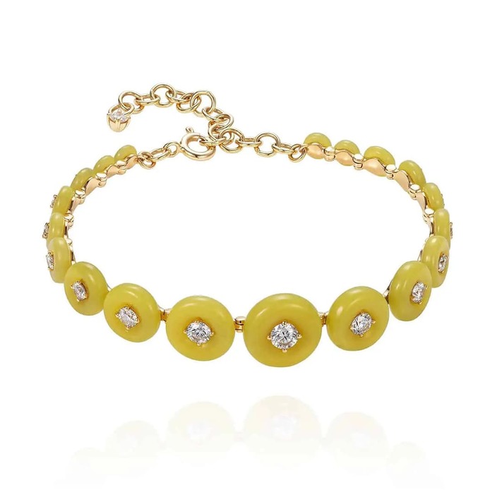 Surrounding bracelet with carved serpentine and diamonds in yellow gold
