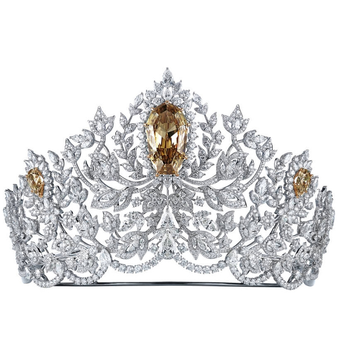 Miss Universe Power of Unity crown with 1,728 white diamonds, three golden canary diamonds originating from Botswana, and a central golden canary diamond weighing 62.83 carats