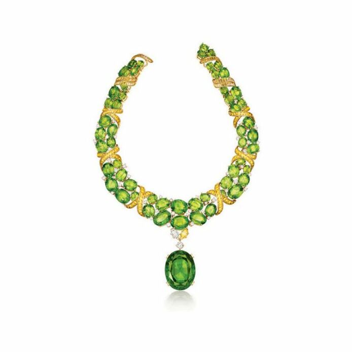 X -necklace with peridot set with 55 cushion-cut peridot, 217 baguette-cut yellow sapphires and 46 round brilliant-cut diamonds