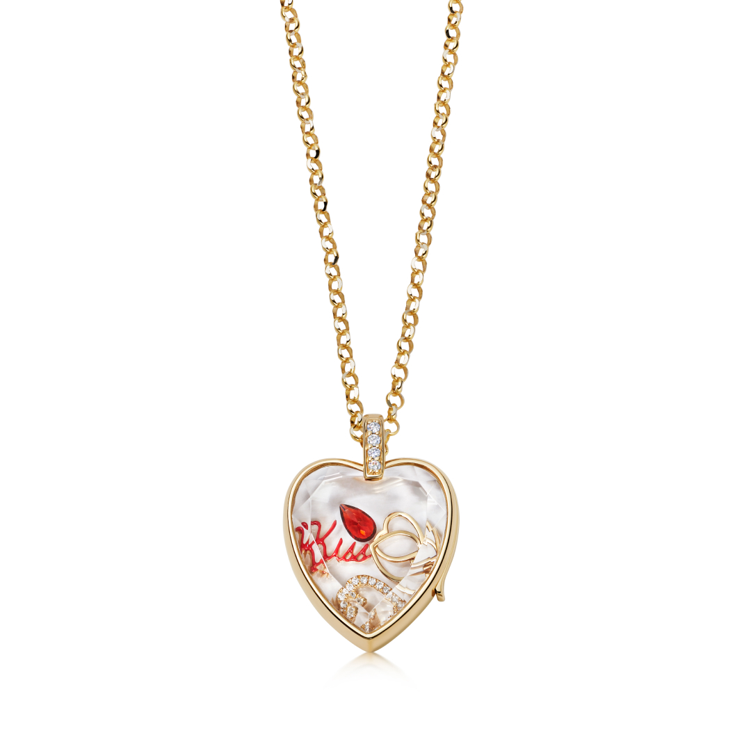 Amate Heart garnet pendant in gold featuring a garnet inside the locket