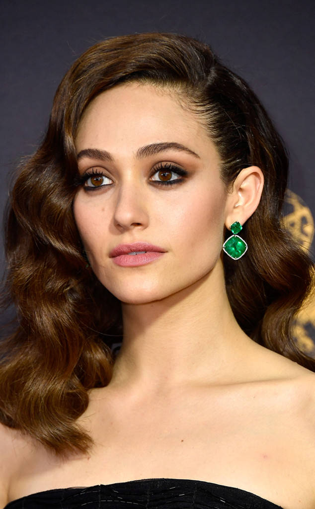 <p>Emmy Rossum wearing Lorraine Schwartz earrings with Colombian emeralds</p>