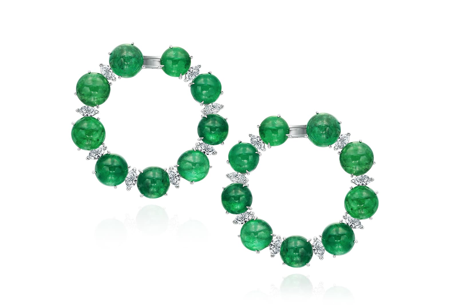 <p>Earrings with 56.40ct cabochon emerald and 2.00ct marquise diamond in 18k white gold</p>
